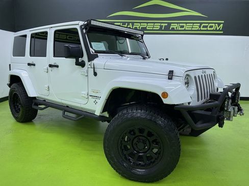 Used 2014 Jeep Wrangler Unlimited Sahara w/ Connectivity Group image 1