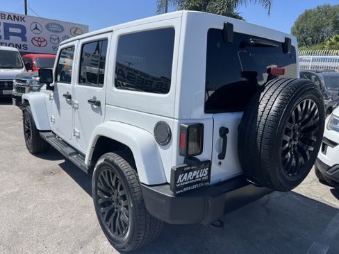 Used 2014 Jeep Wrangler Unlimited Sahara w/ Dual Top Group AWD/4WD image 11