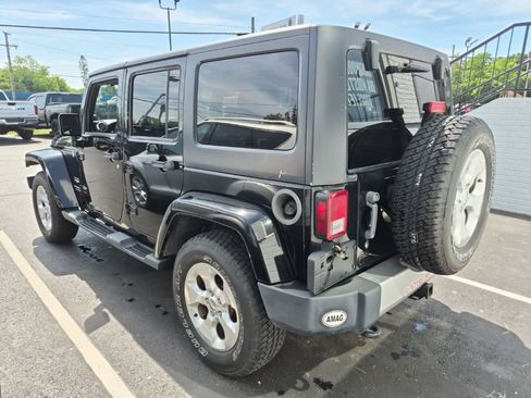 Used 2013 Jeep Wrangler Unlimited Sahara w/ Dual Top Group AWD/4WD image 3