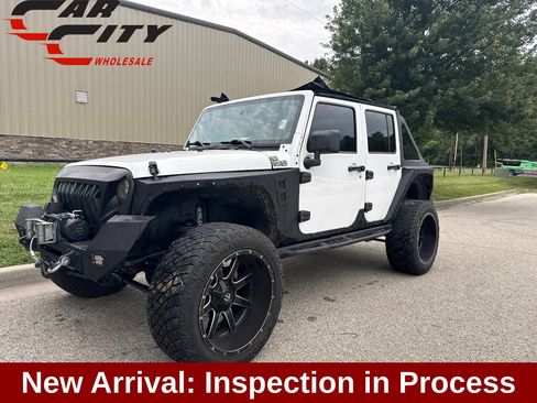 Used 2012 Jeep Wrangler Unlimited Sahara w/ Dual Top Group AWD/4WD image 1