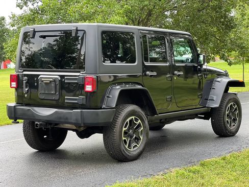 Used 2014 Jeep Wrangler Unlimited Sahara w/ Dual Top Group AWD/4WD image 5