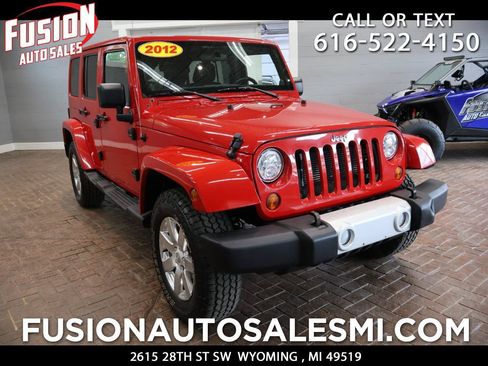 Used 2012 Jeep Wrangler Unlimited Sahara w/ Dual Top Group AWD/4WD image 1