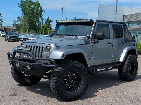 Used 2014 Jeep Wrangler Unlimited Sahara w/ Dual Top Group AWD/4WD image 1