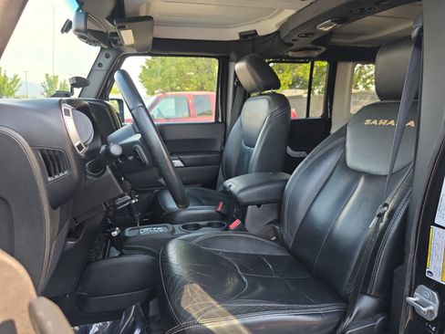 Used 2014 Jeep Wrangler Unlimited Sahara w/ Dual Top Group AWD/4WD image 11