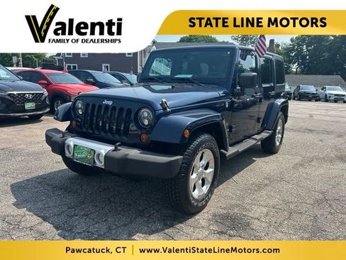 Used 2013 Jeep Wrangler Unlimited Sahara w/ Dual Top Group AWD/4WD image 1