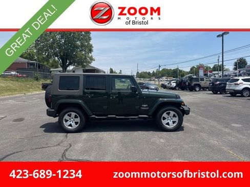 Used 2010 Jeep Wrangler Unlimited Sahara w/ Dual Top Group AWD/4WD image 1
