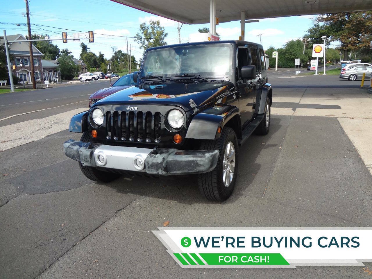Used 2012 Jeep Wrangler Unlimited Sahara w/ Dual Top Group AWD/4WD image 1