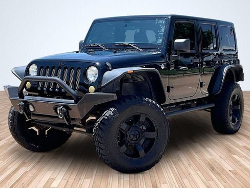 Used 2012 Jeep Wrangler Unlimited Sahara AWD/4WD image 1