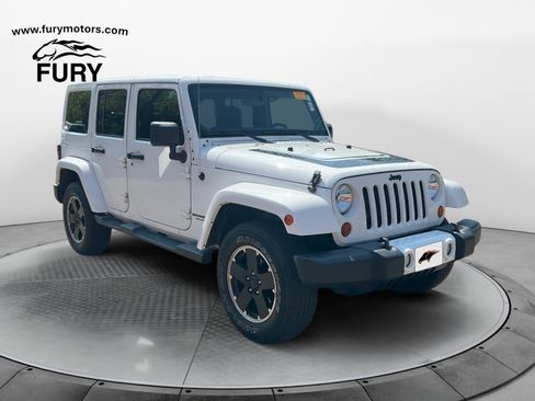 Used 2012 Jeep Wrangler Unlimited Sahara AWD/4WD image 1