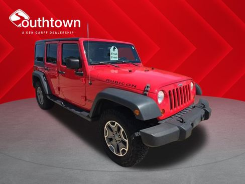 Used 2013 Jeep Wrangler Unlimited Rubicon w/ Dual Top Group AWD/4WD image 1