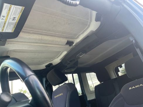 Used 2014 Jeep Wrangler Unlimited Sahara w/ Dual Top Group AWD/4WD image 12