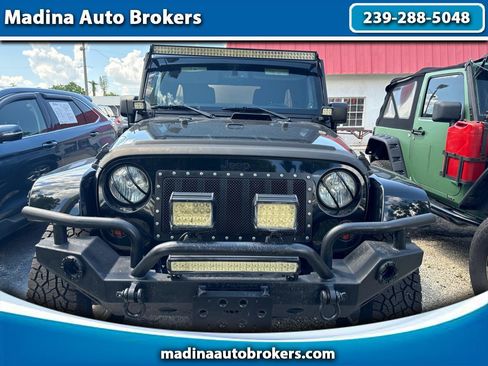 Used 2013 Jeep Wrangler Unlimited Sahara w/ Trailer Tow Group AWD/4WD image 1