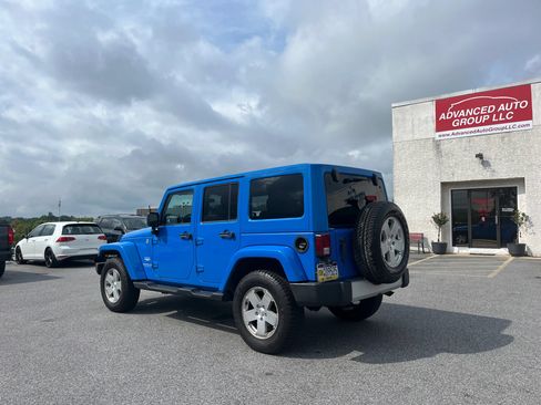 Used 2012 Jeep Wrangler Unlimited Sahara w/ Dual Top Group AWD/4WD image 34
