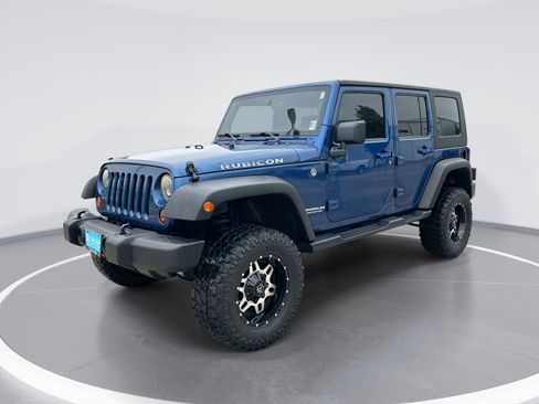 Used 2010 Jeep Wrangler Unlimited Rubicon w/ Dual Top Group AWD/4WD image 1