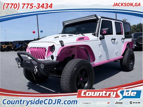 Used 2010 Jeep Wrangler Unlimited Sahara w/ Dual Top Group AWD/4WD image 1