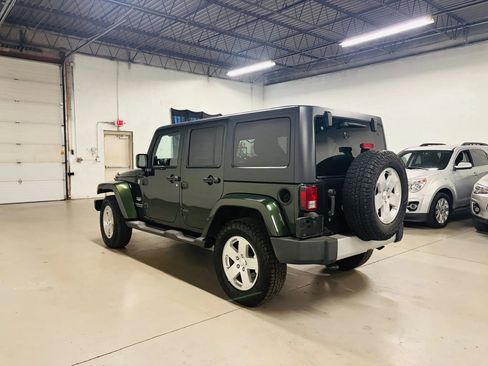 Used 2011 Jeep Wrangler Unlimited Sahara w/ Dual Top Group AWD/4WD image 6