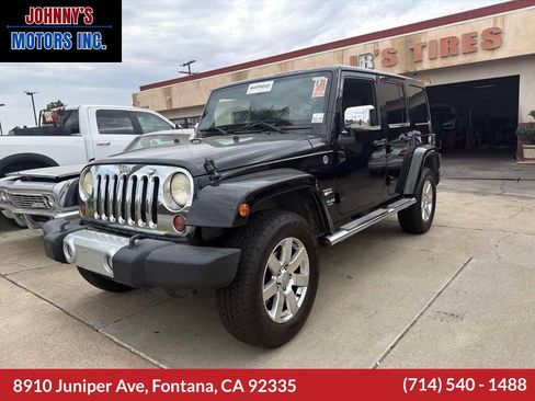 Used 2012 Jeep Wrangler Unlimited Sahara w/ Mopar Chrome Edition Group AWD/4WD image 1