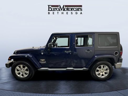 Used 2013 Jeep Wrangler Unlimited Sahara w/ Dual Top Group AWD/4WD image 2