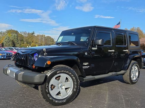 Used 2011 Jeep Wrangler Unlimited Sahara w/ Dual Top Group image 1