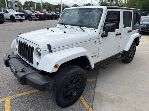 Used 2012 Jeep Wrangler Unlimited Sahara w/ Dual Top Group AWD/4WD image 9