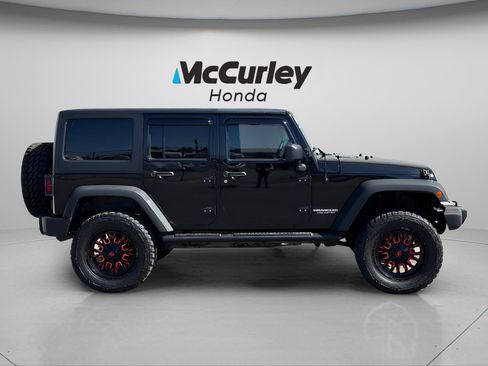 Used 2012 Jeep Wrangler Unlimited Sport w/ Black Appearance Group AWD/4WD image 2