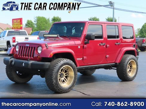 Used 2013 Jeep Wrangler Unlimited Rubicon w/ Dual Top Group AWD/4WD image 1