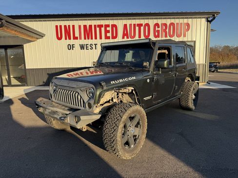 Used 2011 Jeep Wrangler Unlimited Rubicon w/ Dual Top Group AWD/4WD image 1