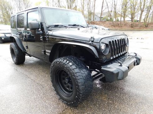 Used 2013 Jeep Wrangler Unlimited Sport AWD/4WD image 1