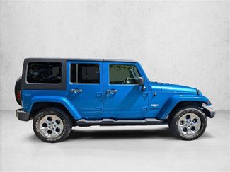 Used 2015 Jeep Wrangler Unlimited Sahara w/ Max Tow Package AWD/4WD video 3