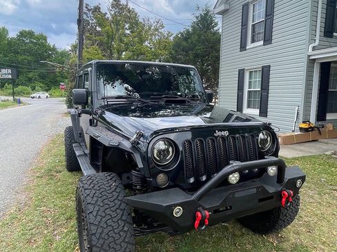 Used 2012 Jeep Wrangler Unlimited Sahara w/ Dual Top Group AWD/4WD image 1