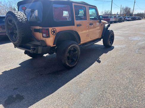 Used 2013 Jeep Wrangler Unlimited Sport w/ Mopar Black Appearance Group image 21