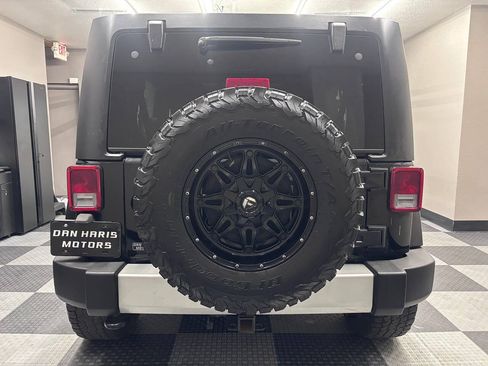 Used 2013 Jeep Wrangler Unlimited Sahara w/ Dual Top Group AWD/4WD image 9