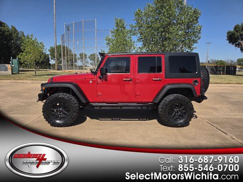 Used 2014 Jeep Wrangler Unlimited Sahara AWD/4WD image 1