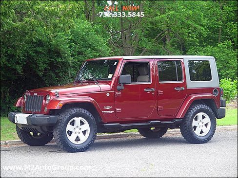 Used 2010 Jeep Wrangler Unlimited Sahara w/ Dual Top Group image 1