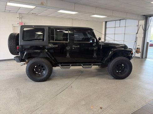 Used 2013 Jeep Wrangler Unlimited Sahara w/ Dual Top Group AWD/4WD image 2