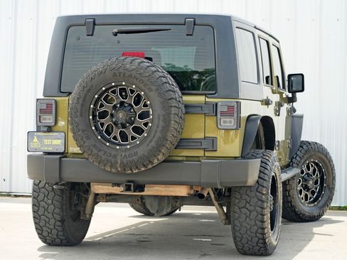 Used 2013 Jeep Wrangler Unlimited Sport w/ Mopar Black Appearance Group image 4