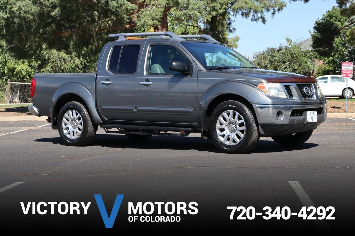 Used 2009 Nissan Frontier LE w/ LE Value Truck Pkg AWD/4WD image 1