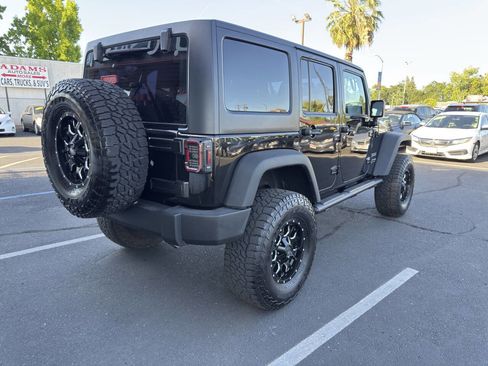 Used 2018 Jeep Wrangler Unlimited Sport w/ Mopar Black Appearance Group AWD/4WD image 3