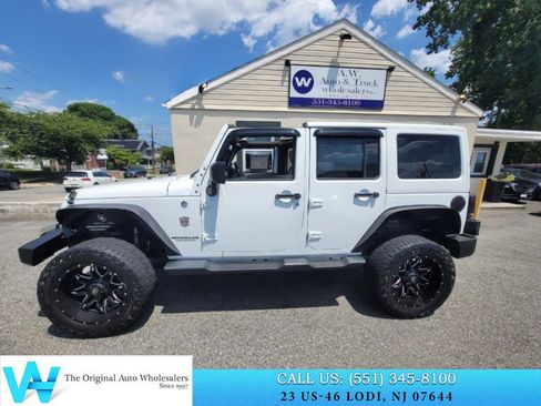 Used 2014 Jeep Wrangler Unlimited Sahara w/ Dual Top Group AWD/4WD image 11