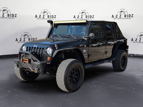 Used 2012 Jeep Wrangler Unlimited Sport AWD/4WD image 2