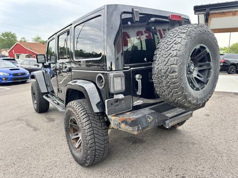 Used 2014 Jeep Wrangler Unlimited Rubicon w/ Dual Top Group AWD/4WD image 11
