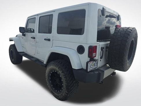 Used 2014 Jeep Wrangler Unlimited Sahara w/ Dual Top Group AWD/4WD image 4