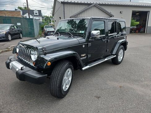 Used 2012 Jeep Wrangler Unlimited Sahara w/ Dual Top Group AWD/4WD image 7