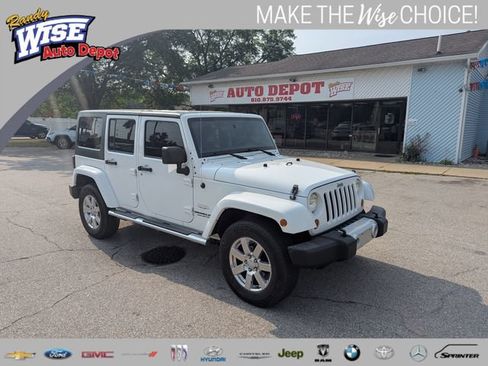 Used 2012 Jeep Wrangler Unlimited Sahara w/ Dual Top Group AWD/4WD image 1