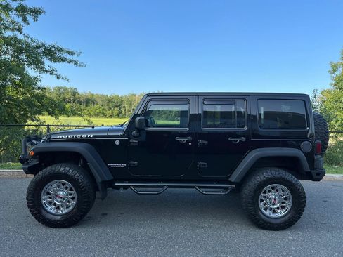 Used 2014 Jeep Wrangler Unlimited Rubicon w/ Dual Top Group AWD/4WD image 7