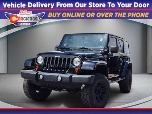 Used 2013 Jeep Wrangler Unlimited Sahara AWD/4WD image 1
