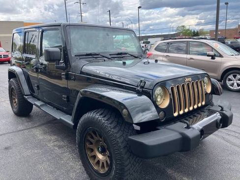 Used 2014 Jeep Wrangler Unlimited Sahara AWD/4WD image 1
