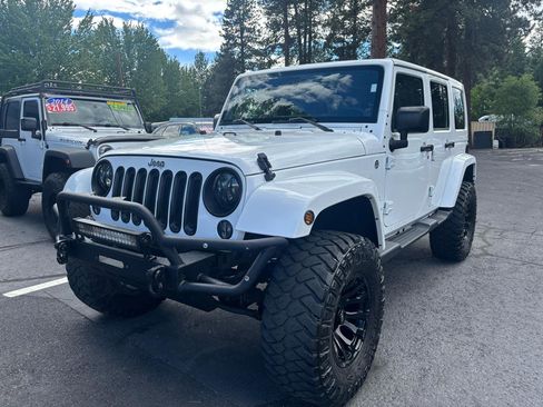 Used 2014 Jeep Wrangler Unlimited Sahara w/ Dual Top Group AWD/4WD image 1