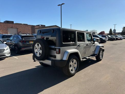 Used 2012 Jeep Wrangler Unlimited Sahara w/ Dual Top Group AWD/4WD image 2