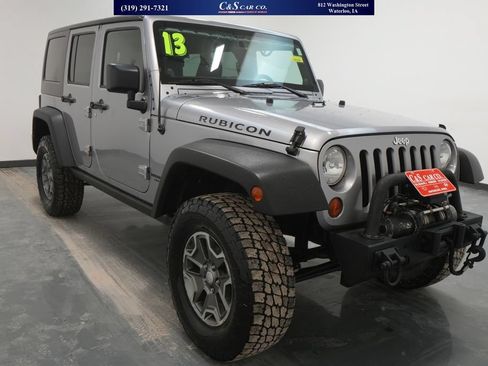 Used 2013 Jeep Wrangler Unlimited Rubicon w/ Dual Top Group AWD/4WD image 1